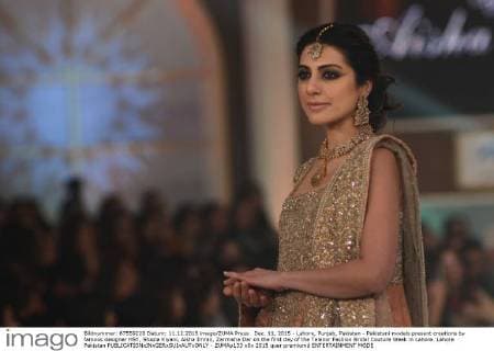 Dec. 11, 2015 - Lahore, Punjab, Pakistan - Pakistani models present creations by famous designer HSY, Shazia Kiyani, Aisha Imran, Zarmisha Dar on the first day of the Telenor Fashion Bridal Couture Week in Lahore. Lahore Pakistan - ZUMAp133