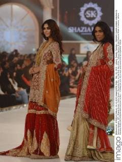 Dec. 11, 2015 - Lahore, Punjab, Pakistan - Pakistani models present creations by famous designer HSY, Shazia Kiyani, Aisha Imran, Zarmisha Dar on the first day of the Telenor Fashion Bridal Couture Week in Lahore. Lahore Pakistan - ZUMAp133