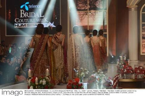 Dec. 11, 2015 - Lahore, Punjab, Pakistan - Pakistani models present creations by famous designer HSY, Shazia Kiyani, Aisha Imran, Zarmisha Dar on the first day of the Telenor Fashion Bridal Couture Week in Lahore. Lahore Pakistan - ZUMAp133