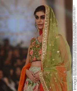 Dec. 11, 2015 - Lahore, Punjab, Pakistan - Pakistani models present creations by famous designer HSY, Shazia Kiyani, Aisha Imran, Zarmisha Dar on the first day of the Telenor Fashion Bridal Couture Week in Lahore. Lahore Pakistan - ZUMAp133