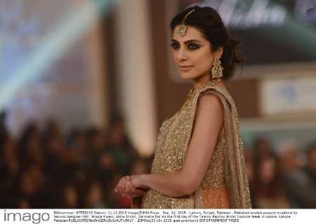 Dec. 11, 2015 - Lahore, Punjab, Pakistan - Pakistani models present creations by famous designer HSY, Shazia Kiyani, Aisha Imran, Zarmisha Dar on the first day of the Telenor Fashion Bridal Couture Week in Lahore. Lahore Pakistan - ZUMAp133