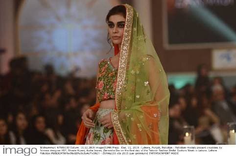 Dec. 11, 2015 - Lahore, Punjab, Pakistan - Pakistani models present creations by famous designer HSY, Shazia Kiyani, Aisha Imran, Zarmisha Dar on the first day of the Telenor Fashion Bridal Couture Week in Lahore. Lahore Pakistan - ZUMAp133