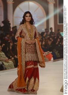 Dec. 11, 2015 - Lahore, Punjab, Pakistan - Pakistani models present creations by famous designer HSY, Shazia Kiyani, Aisha Imran, Zarmisha Dar on the first day of the Telenor Fashion Bridal Couture Week in Lahore. Lahore Pakistan - ZUMAp133