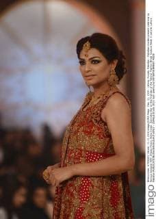 Dec. 11, 2015 - Lahore, Punjab, Pakistan - Pakistani models present creations by famous designer HSY, Shazia Kiyani, Aisha Imran, Zarmisha Dar on the first day of the Telenor Fashion Bridal Couture Week in Lahore. Lahore Pakistan - ZUMAp133