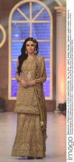 Dec. 11, 2015 - Lahore, Punjab, Pakistan - Pakistani models present creations by famous designer HSY, Shazia Kiyani, Aisha Imran, Zarmisha Dar on the first day of the Telenor Fashion Bridal Couture Week in Lahore. Lahore Pakistan - ZUMAp133