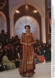 Dec. 11, 2015 - Lahore, Punjab, Pakistan - Pakistani models present creations by famous designer HSY, Shazia Kiyani, Aisha Imran, Zarmisha Dar on the first day of the Telenor Fashion Bridal Couture Week in Lahore. Lahore Pakistan - ZUMAp133