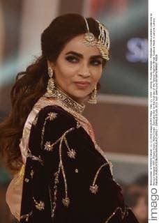 Dec. 11, 2015 - Lahore, Punjab, Pakistan - Pakistani models present creations by famous designer HSY, Shazia Kiyani, Aisha Imran, Zarmisha Dar on the first day of the Telenor Fashion Bridal Couture Week in Lahore. Lahore Pakistan - ZUMAp133