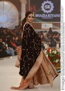 Dec. 11, 2015 - Lahore, Punjab, Pakistan - Pakistani models present creations by famous designer HSY, Shazia Kiyani, Aisha Imran, Zarmisha Dar on the first day of the Telenor Fashion Bridal Couture Week in Lahore. Lahore Pakistan - ZUMAp133