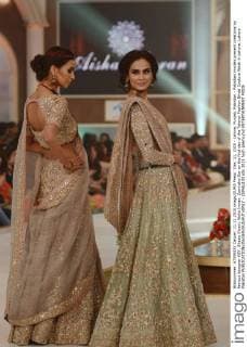 Dec. 11, 2015 - Lahore, Punjab, Pakistan - Pakistani models present creations by famous designer HSY, Shazia Kiyani, Aisha Imran, Zarmisha Dar on the first day of the Telenor Fashion Bridal Couture Week in Lahore. Lahore Pakistan - ZUMAp133
