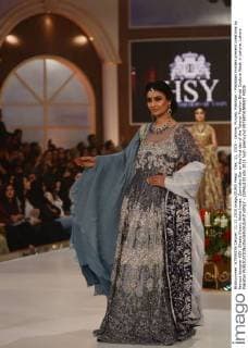 Dec. 11, 2015 - Lahore, Punjab, Pakistan - Pakistani models present creations by famous designer HSY, Shazia Kiyani, Aisha Imran, Zarmisha Dar on the first day of the Telenor Fashion Bridal Couture Week in Lahore. Lahore Pakistan - ZUMAp133