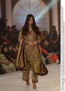Dec. 11, 2015 - Lahore, Punjab, Pakistan - Pakistani models present creations by famous designer HSY, Shazia Kiyani, Aisha Imran, Zarmisha Dar on the first day of the Telenor Fashion Bridal Couture Week in Lahore. Lahore Pakistan - ZUMAp133