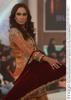 Dec. 11, 2015 - Lahore, Punjab, Pakistan - Pakistani models present creations by famous designer HSY, Shazia Kiyani, Aisha Imran, Zarmisha Dar on the first day of the Telenor Fashion Bridal Couture Week in Lahore. Lahore Pakistan - ZUMAp133