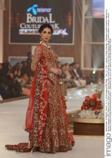 Dec. 11, 2015 - Lahore, Punjab, Pakistan - Pakistani models present creations by famous designer HSY, Shazia Kiyani, Aisha Imran, Zarmisha Dar on the first day of the Telenor Fashion Bridal Couture Week in Lahore. Lahore Pakistan - ZUMAp133