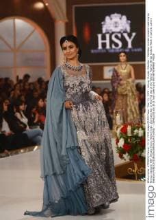 Dec. 11, 2015 - Lahore, Punjab, Pakistan - Pakistani models present creations by famous designer HSY, Shazia Kiyani, Aisha Imran, Zarmisha Dar on the first day of the Telenor Fashion Bridal Couture Week in Lahore. Lahore Pakistan - ZUMAp133