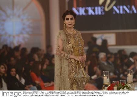 Dec. 11, 2015 - Lahore, Punjab, Pakistan - Pakistani models present creations by famous designer HSY, Shazia Kiyani, Aisha Imran, Zarmisha Dar on the first day of the Telenor Fashion Bridal Couture Week in Lahore. Lahore Pakistan - ZUMAp133