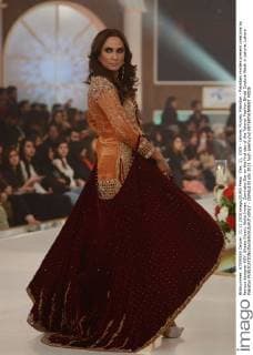 Dec. 11, 2015 - Lahore, Punjab, Pakistan - Pakistani models present creations by famous designer HSY, Shazia Kiyani, Aisha Imran, Zarmisha Dar on the first day of the Telenor Fashion Bridal Couture Week in Lahore. Lahore Pakistan - ZUMAp133