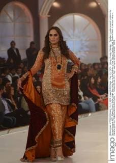 Dec. 11, 2015 - Lahore, Punjab, Pakistan - Pakistani models present creations by famous designer HSY, Shazia Kiyani, Aisha Imran, Zarmisha Dar on the first day of the Telenor Fashion Bridal Couture Week in Lahore. Lahore Pakistan - ZUMAp133