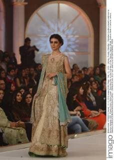 Dec. 11, 2015 - Lahore, Punjab, Pakistan - Pakistani models present creations by famous designer HSY, Shazia Kiyani, Aisha Imran, Zarmisha Dar on the first day of the Telenor Fashion Bridal Couture Week in Lahore. Lahore Pakistan - ZUMAp133