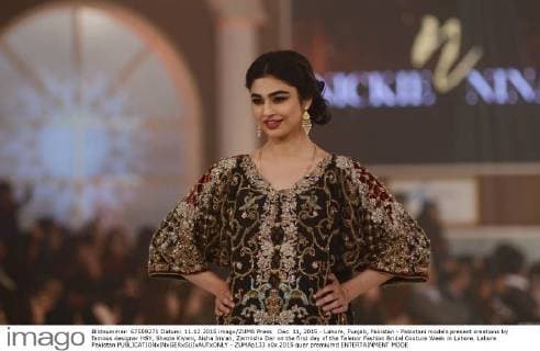 Dec. 11, 2015 - Lahore, Punjab, Pakistan - Pakistani models present creations by famous designer HSY, Shazia Kiyani, Aisha Imran, Zarmisha Dar on the first day of the Telenor Fashion Bridal Couture Week in Lahore. Lahore Pakistan - ZUMAp133