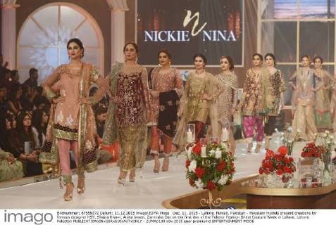 Dec. 11, 2015 - Lahore, Punjab, Pakistan - Pakistani models present creations by famous designer HSY, Shazia Kiyani, Aisha Imran, Zarmisha Dar on the first day of the Telenor Fashion Bridal Couture Week in Lahore. Lahore Pakistan - ZUMAp133