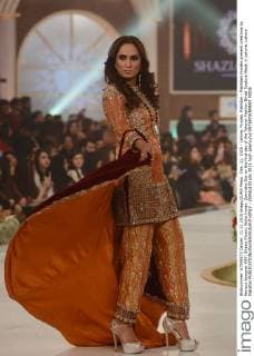 Dec. 11, 2015 - Lahore, Punjab, Pakistan - Pakistani models present creations by famous designer HSY, Shazia Kiyani, Aisha Imran, Zarmisha Dar on the first day of the Telenor Fashion Bridal Couture Week in Lahore. Lahore Pakistan - ZUMAp133