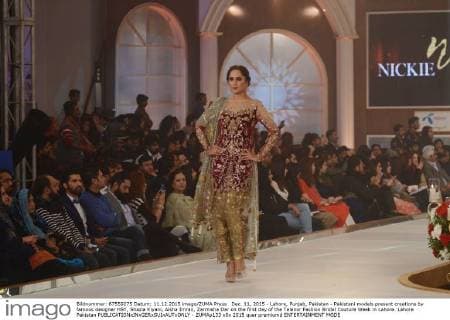 Dec. 11, 2015 - Lahore, Punjab, Pakistan - Pakistani models present creations by famous designer HSY, Shazia Kiyani, Aisha Imran, Zarmisha Dar on the first day of the Telenor Fashion Bridal Couture Week in Lahore. Lahore Pakistan - ZUMAp133