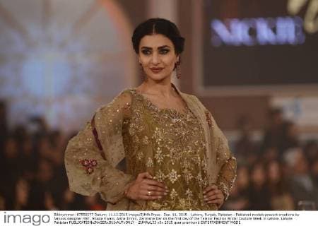 Dec. 11, 2015 - Lahore, Punjab, Pakistan - Pakistani models present creations by famous designer HSY, Shazia Kiyani, Aisha Imran, Zarmisha Dar on the first day of the Telenor Fashion Bridal Couture Week in Lahore. Lahore Pakistan - ZUMAp133