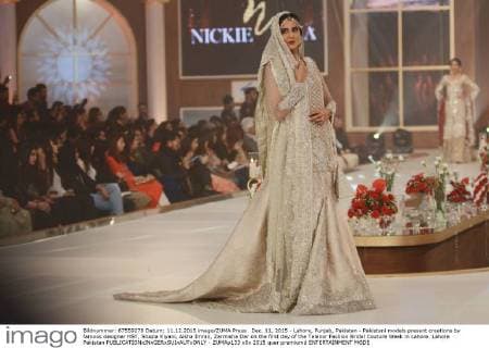 Dec. 11, 2015 - Lahore, Punjab, Pakistan - Pakistani models present creations by famous designer HSY, Shazia Kiyani, Aisha Imran, Zarmisha Dar on the first day of the Telenor Fashion Bridal Couture Week in Lahore. Lahore Pakistan - ZUMAp133