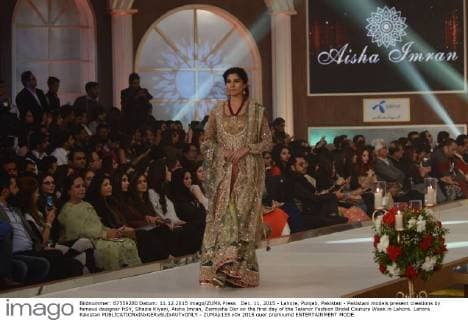 Dec. 11, 2015 - Lahore, Punjab, Pakistan - Pakistani models present creations by famous designer HSY, Shazia Kiyani, Aisha Imran, Zarmisha Dar on the first day of the Telenor Fashion Bridal Couture Week in Lahore. Lahore Pakistan - ZUMAp133