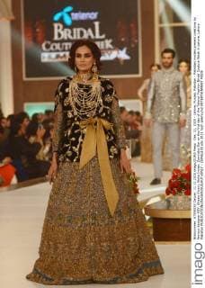 Dec. 11, 2015 - Lahore, Punjab, Pakistan - Pakistani models present creations by famous designer HSY, Shazia Kiyani, Aisha Imran, Zarmisha Dar on the first day of the Telenor Fashion Bridal Couture Week in Lahore. Lahore Pakistan - ZUMAp133