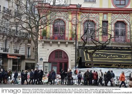 Dec. 13, 2015 - Paris, France - People wait in queue in front of the Bataclan concert hall in to put a flowers and candle of lights in memorial of the victims of the terrorist attacks a month ago Paris, France on December 13, 2015 Paris France  - ZUMAn230