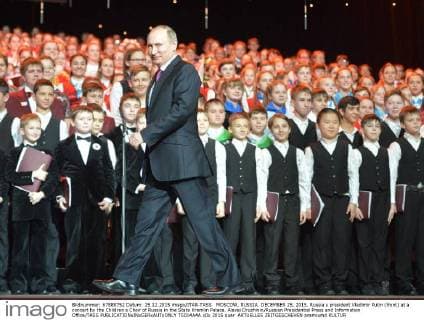 MOSCOW, RUSSIA. DECEMBER 25, 2015. Russia s president Vladimir Putin (front) at a concert by the Children s Choir of Russia in the State Kremlin Palace. Alexei Druzhinin Russian Presidential Press and Information Office TASS  TS014A4A