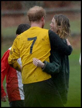 . 24 12 2015. Castle Rising, United Kingdom. Prince William and Prince Harry playing football on Christmas Eve in Castle Rising, Norfolk. Prince Harry Cuddles a girl after the match.  xAndrewxParsonsx xi-Imagesx IIM-11620-0069