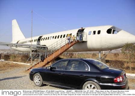 (151227) -- NEIHUANG, Dec. 27, 2015 -- Photo taken on Dec. 27 shows the plane model made by farmer Wang Lanqun, in Neihuang County, central China s Henan Province. 61-year-old farmer Wang Lanqun, has started making this plane since the end of 2014. According to Wang, the 35-meter-long and 38-meter-wide plane will be used as dining place after furnishing. ) (dhf) CHINA-HENAN-FARMER-PLANE MODEL (CN) LiuxXiaokun 