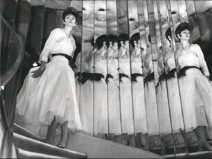 IMAGO ICONS: Coco Chanel 1963 - Great Couturiers present their spring summer fashion; A Glimpse of Coco Chanel s new 1963 line; Photo Shows Evening dress of white organdi and red belt obligatory mention creation chanel immediate diffusion. - ZUMAk09_