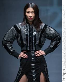 (160108) -- BEIJING, Jan. 8, 2016 -- A model presents a creation with a theme of Be Half at Beijing Institute of Clothing Technology in Beijing, capital of China, Jan. 7, 2016. ) (lfj) CHINA-BEIJING-FASHION SHOW (CN) LixJianbo 