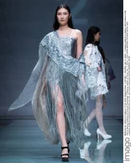(160108) -- BEIJING, Jan. 8, 2016 -- A model presents a creation with a theme of Be Half at Beijing Institute of Clothing Technology in Beijing, capital of China, Jan. 7, 2016. ) (lfj) CHINA-BEIJING-FASHION SHOW (CN) LixJianbo 
