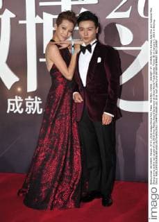 BEIJING, CHINA - JANUARY 07: (CHINA OUT) Actress Ada Choi and husband Max Zhang arrive at the red carpet of the 2015 Sina Weibo Award Ceremony at China World Trade Center Tower III on January 7, 2016 in Beijing, China.  CFP477916085