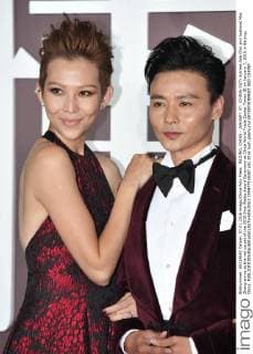 BEIJING, CHINA - JANUARY 07: (CHINA OUT) Actress Ada Choi and husband Max Zhang arrive at the red carpet of the 2015 Sina Weibo Award Ceremony at China World Trade Center Tower III on January 7, 2016 in Beijing, China.  CFP477916087