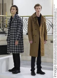 . 09 01 2016. London, United Kingdom. Two models wearing a block check wool coat (left) and a rubberized traditional mac at the Mackintosh show on day two of London Men s Fashion Week for autumn winter 2016.  xStephenxLockx xi-Imagesx IIM-11693-0002