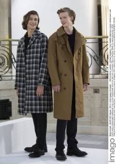 . 09 01 2016. London, United Kingdom. Two models wearing a block check wool coat (left) and a rubberized traditional mac at the Mackintosh show on day two of London Men s Fashion Week for autumn winter 2016.  xStephenxLockx xi-Imagesx IIM-11693-0003