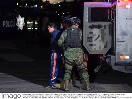 Jan. 8, 2016 - Mexico, Distrito Federal, MEXICO - Joaquin El Chapo Guzman faces the press as he is escorted to a helicopter in handcuffs by Mexican soldiers and marines at a federal hangar in Mexico City, Mexico, Friday January. 8, 2016. ANTONIO NAVA PI Mexico MEXICO - ZUMAp124