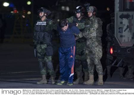 Jan. 8, 2016 - Mexico, Distrito Federal, MEXICO - Joaquin El Chapo Guzman faces the press as he is escorted to a helicopter in handcuffs by Mexican soldiers and marines at a federal hangar in Mexico City, Mexico, Friday January. 8, 2016. ANTONIO NAVA PI Mexico MEXICO - ZUMAp124