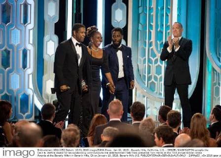 Jan 10, 2016 - Beverly Hills, California, U.S. - DENZEL WASHINGTON accepts the Cecil B. DeMille Award for his outstanding contribution to the entertainment field from presenter Tom Hanks at the 73rd Annual Golden Globe Awards at the Beverly Hilton in Beverly Hills, CA on January 10, 2016. Beverly Hills U.S. - ZUMAz03_
