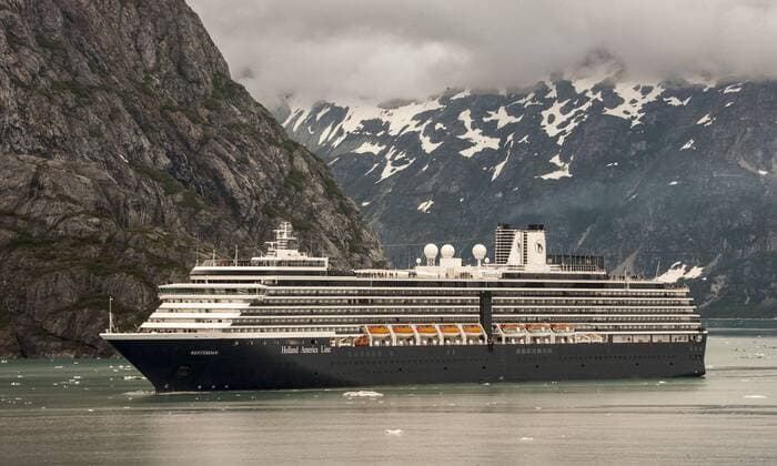 July 3, 2012 - Glacier Bay, Alaska, US - Holland America Lines ms Westerdam cruising past the awe-inspiring, snow topped peaks of the Fairweather Mountain Range in Glacier Bay, whose landscape can dwarf the largest ships that enter its waters. Glacier Bay covers 3.3 million acres (1.3 million hectares) of rugged mountains, dynamic glaciers, temperate rainforest, wild coastlines, deep sheltered fjords and wildlife. A highlight of the Alaskan Inside Passage and part of a 25-million acre (10.1 million hectares) World Heritage Site, it is the largest UNESCO protected biosphere in the world. Almost half a million tourists visit each year, mostly cruise ship passengers. - ZUMAd84