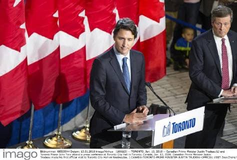 (160113) -- TORONTO, Jan. 13, 2016 -- Canadian Prime Minister Justin Trudeau(L) and Toronto Mayor John Tory attend a press conferece at Toronto City Hall in Toronto, Canada, Jan. 13, 2016. Canadian Prime Minister Justin Trudeau made his first official visit to Toronto City Hall on Wednesday. ) CANADA-TORONTO-PRIME MINISTER-JUSTIN TRUDEAU-OFFICIAL VISIT ZouxZheng 