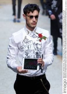 A model displays a creation as part of the Dolce & Gabbana men s Fall-Winter 2016-2017 show collection during Milan Fashion Week in Milan, Italy, on Jan. 16, 2016. Inspired by the iconic Spaghetti Western movies directed by an Italian director Sergio Leone in the 1960s, which brought the Italian movie industry to the attention of the international crowds, the collection shows a contrast between the past (via the embroideries and embellishments of the Wild West) and the present (the shapes, cut, and fit). ) ITALY-MILAN-D&G-FASHION WEEK JinxYu 