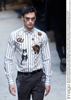 A model displays a creation as part of the Dolce & Gabbana men s Fall-Winter 2016-2017 show collection during Milan Fashion Week in Milan, Italy, on Jan. 16, 2016. Inspired by the iconic Spaghetti Western movies directed by an Italian director Sergio Leone in the 1960s, which brought the Italian movie industry to the attention of the international crowds, the collection shows a contrast between the past (via the embroideries and embellishments of the Wild West) and the present (the shapes, cut, and fit). ) ITALY-MILAN-D&G-FASHION WEEK JinxYu 