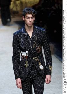 A model displays a creation as part of the Dolce & Gabbana men s Fall-Winter 2016-2017 show collection during Milan Fashion Week in Milan, Italy, on Jan. 16, 2016. Inspired by the iconic Spaghetti Western movies directed by an Italian director Sergio Leone in the 1960s, which brought the Italian movie industry to the attention of the international crowds, the collection shows a contrast between the past (via the embroideries and embellishments of the Wild West) and the present (the shapes, cut, and fit). ) ITALY-MILAN-D&G-FASHION WEEK JinxYu 