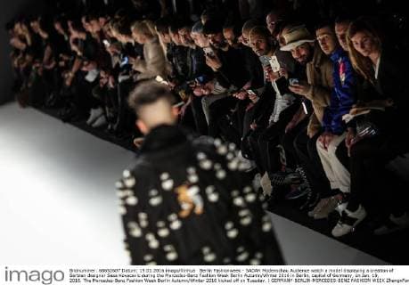 Berlin Fashionweek - SADAK Modenschau Audience watch a model displaying a creation of Serbian designer Sasa Kovacevic during the Mercedes-Benz Fashion Week Berlin Autumn Winter 2016 in Berlin, capital of Germany, on Jan. 19, 2016. The Mercedes-Benz Fashion Week Berlin Autumn Winter 2016 kicked off on Tuesday. ) GERMANY-BERLIN-MERCEDES-BENZ FASHION WEEK ZhangxFan 